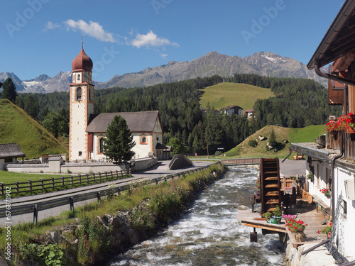 Church (Pfarrkirche Hl. Antonius), mill wheel, stream, mountains, landscape, Alps, July, Niederthai, Tyrol, Austria, high resolution photo