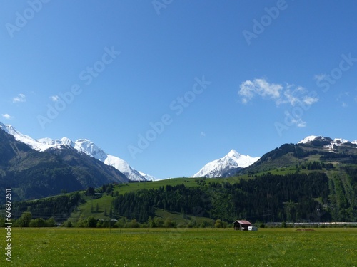 Beautiful shot of a rural village with mountains near the Austrian alps
