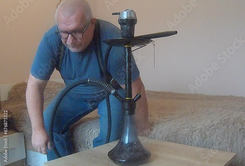 man smoking hookah