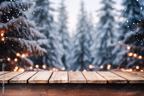 Christmas background, empty wooden tabletop against snowy forest background, sparkling garlands, lights, bokeh