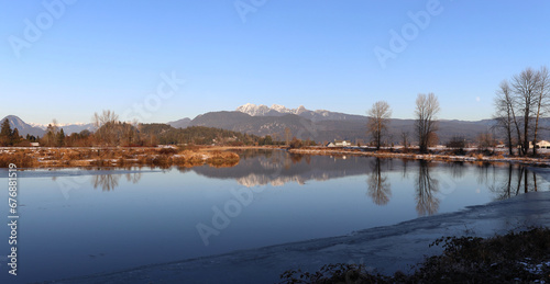 Cold morning winter scenery with snow-capped mountains