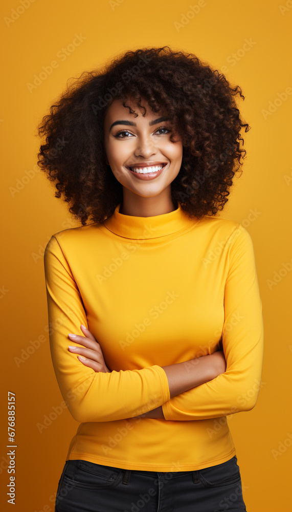 Portrait of a woman with afro hair smiling on yellow background. Portrait of a woman with afro hair smiling on yellow background.