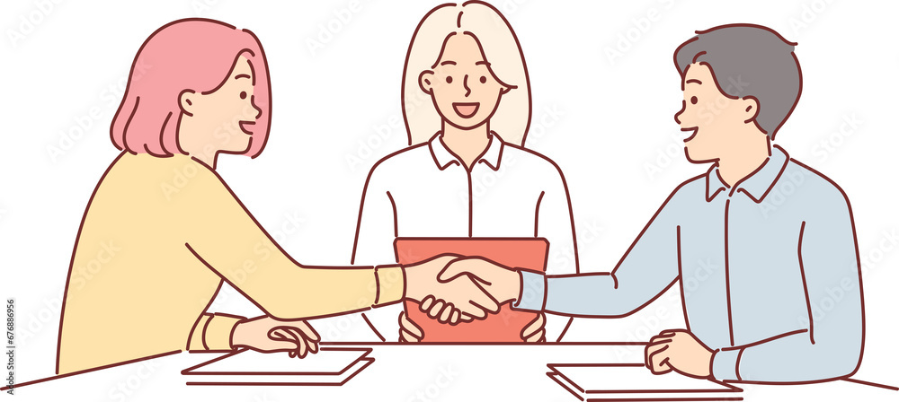 Handshake of business partners sitting at negotiating table, discussing terms of deal Handshake of business partners sitting at negotiating table, discussing terms of deal