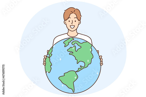 Smiling man hold planet earth in hands