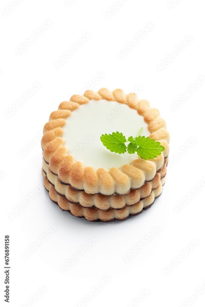 Stack of cream filling biscuits isolated on white