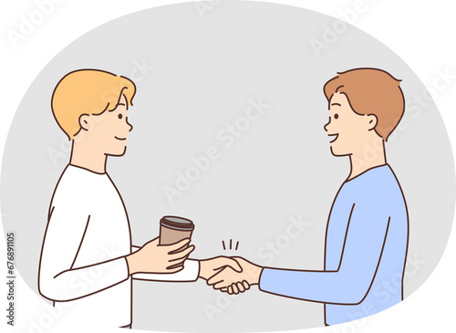 Smiling men shaking hands greeting