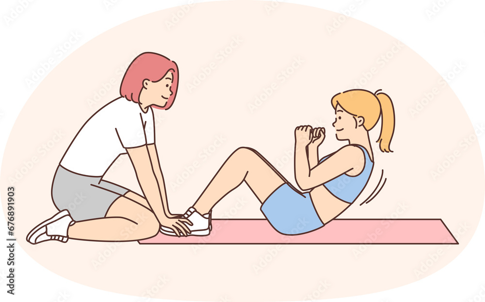 Woman training with coach in gym