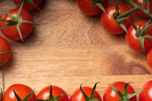 Top view of cherry tomatoes branch  space for text  close up  