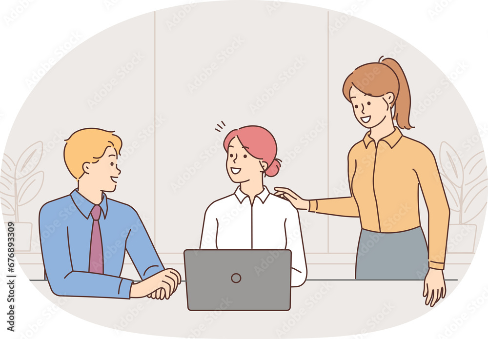 Smiling businesspeople collaborate on computer Smiling businesspeople collaborate on computer
