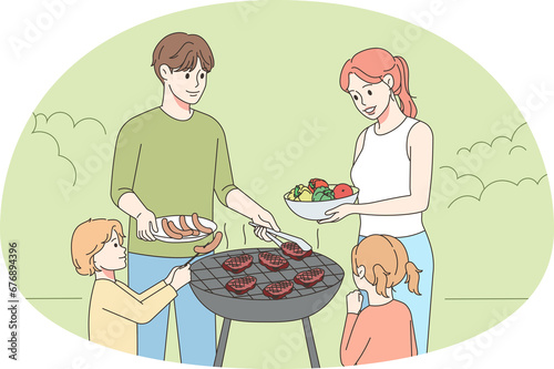 Happy family with kids enjoy picnic
