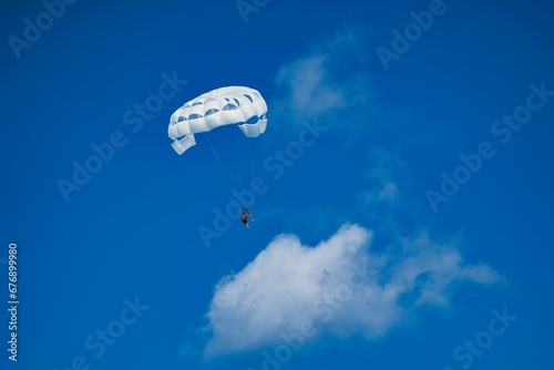 Paragliding in blue sky in Punta Cana