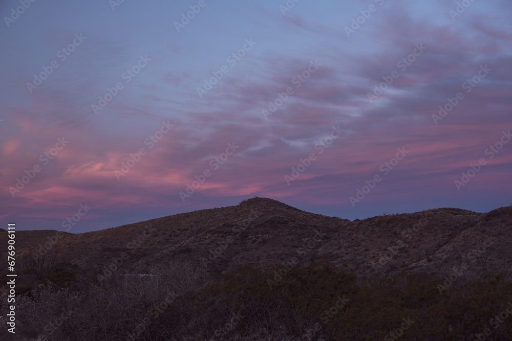 Pink Clouds Reach Across The Empty Desert Of Big Bend