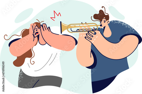 Man plays trombone, causing discomfort to woman covers ears and does not want to listen to music