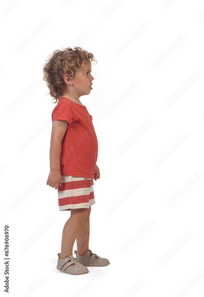 side view of a boy dressed in summer clotheswhite background (3 year old) side view of a boy dressed in summer clotheswhite background (3 year old)