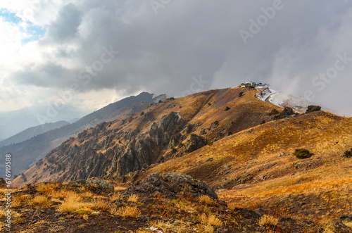 Amirsoy mountain peak covered in clouds (Tashkent region, Uzbekistan)  photo