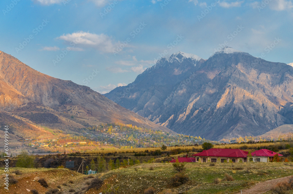 scenic view of snow covered peaks of Chatkal ridge from Charvak reservoir (Yusufhona, Tashkent region, Uzbekistan)