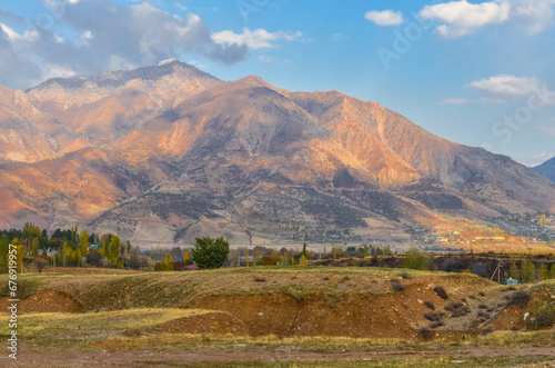 Pskem ridge scenic view from Charvak reservoir (Yusufhona, Tashkent region, Uzbekistan) photo