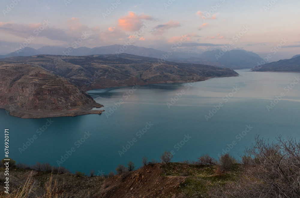 scenic view of Charvak reservoir and Tian Shan mountains in late autumn (Tashkent region, Uzbekistan)