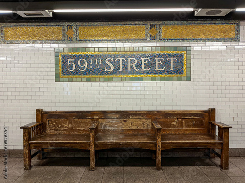 59th street subway sign above a wooden bench in Manhattan, New York City, USA