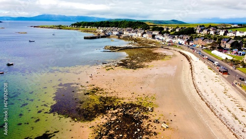 Aerial view of a beach with a seascape in Scotland on a sunny day