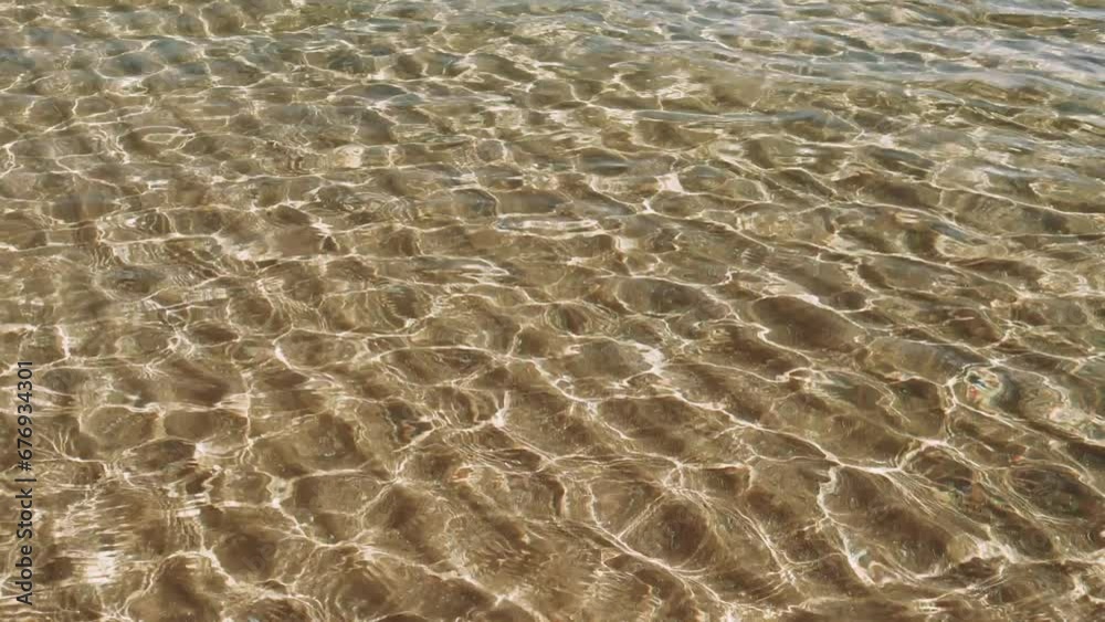Close-up of clear water ripples, a dance of light and motion. Each splash in the clear water creates mesmerizing patterns. Clear water surface reflects a world in constant movement Close-up of clear water ripples, a dance of light and motion. Each splash in the clear water creates mesmerizing patterns. Clear water surface reflects a world in constant movement