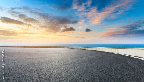asphalt road and sea with sky clouds natural landscape at sunrise