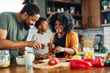 child family kitchen food boy son mother father breakfast preparing egg morning healthy diet eating home black african american father cooking, parent, cute, meal