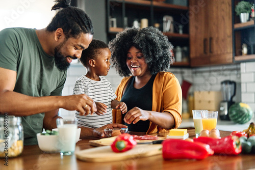 child family kitchen food boy son mother father breakfast preparing egg morning healthy diet eating home black african american father cooking, parent, cute, meal