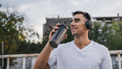 Canvastavla athlete man caucasian male hold supplement shaker outdoor