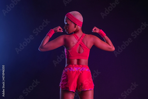 Sporty fit woman, athlete make fitness exercises on neon background. Download cover for music collection for fitness classes. Sports recreation. Beautiful black young woman. © Mike Orlov