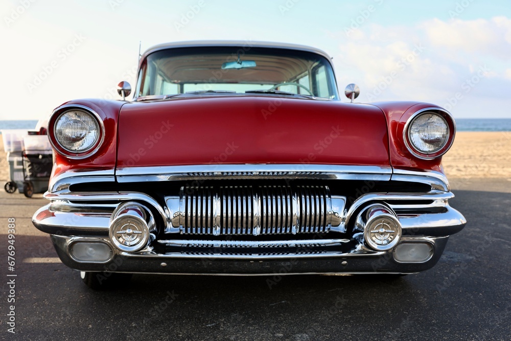 front view of a 1950s red muscle car 