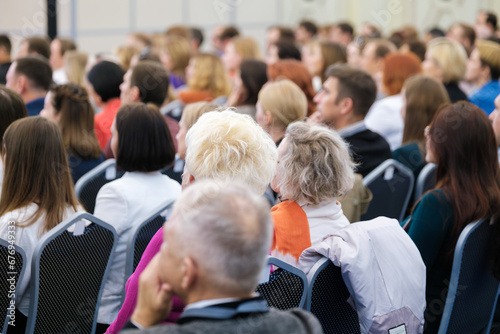 Diverse group of business professional attending international seminar at conference hall © Anton Gvozdikov