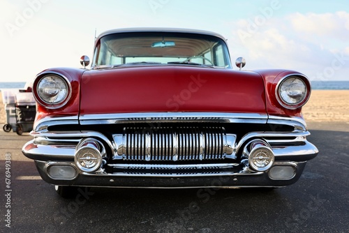 front view of a 1950s red muscle car  photo