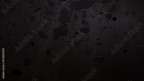 Asteroid belt field in dark outer space. 3D animation wide tracking shot. Rock formations of cosmic debris and giant Meteorites. Celestial objects on black background with dust nebula haze low light photo