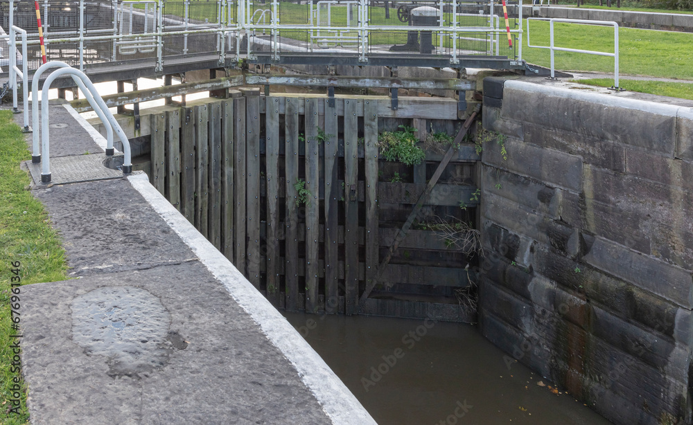 Stepped lock gates with water behind them and lower level at the front
