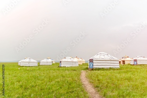 Tents in a green field © Wirestock