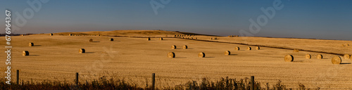 Hay bales in a fall harvested field. Rockyview County, Alberta, Canada photo
