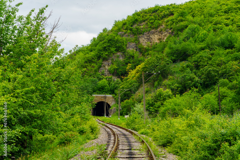 Fototapeta premium Railway tunnel. Background with selective focus and copy space