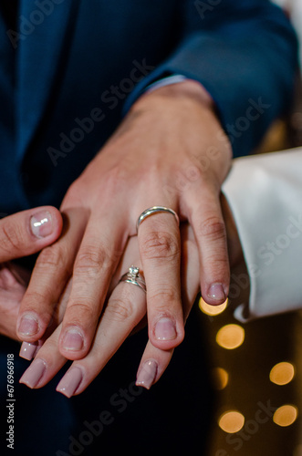 bride and groom holding hands