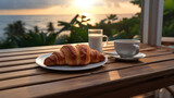 Coffee and croissants - idyllic breakfast by the sea