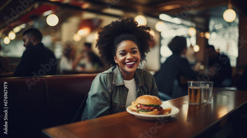 Young smiling black woman going to eat pizza in a restaurant