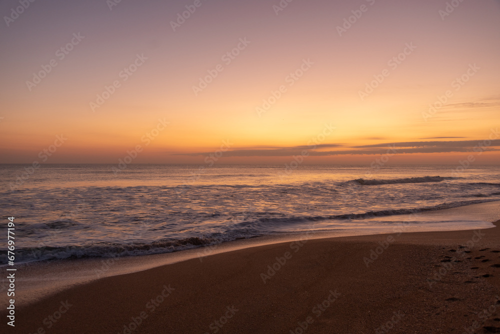 Crashing waves at sunrise during golden hour on Florida east coast beach