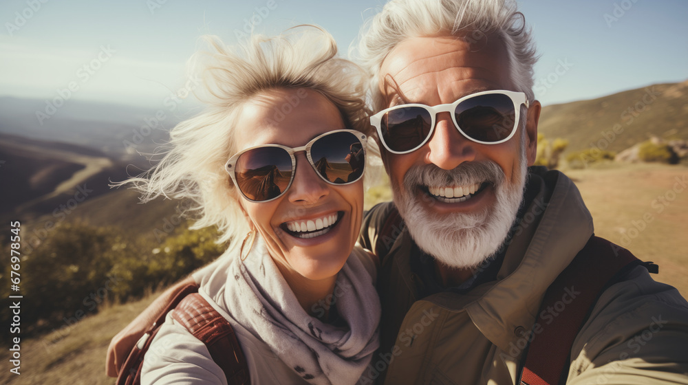 A cute elderly couple enjoying they carefree vacation during a hike. Sunny afternoon A cute elderly couple enjoying they carefree vacation during a hike. Sunny afternoon