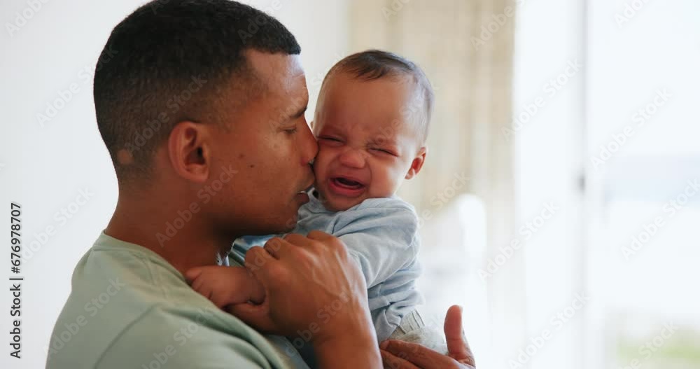 Father, crying baby and comfort, kiss and care, love and bonding in family home together. Dad, sad infant and parent support newborn, holding frustrated young kid and calm child, stress and console Father, crying baby and comfort, kiss and care, love and bonding in family home together. Dad, sad infant and parent support newborn, holding frustrated young kid and calm child, stress and console