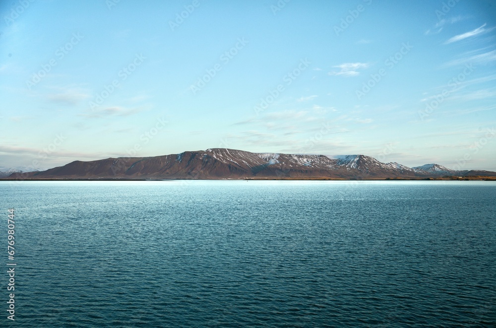 Landscape view of the seascape with the mountains in the background