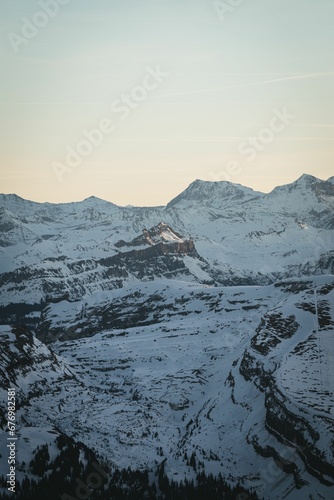 Vertical shot of the Swiss Alps. Beautiful snowy range.