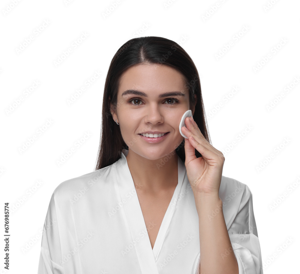 Young woman cleaning her face with cotton pad on white background Young woman cleaning her face with cotton pad on white background