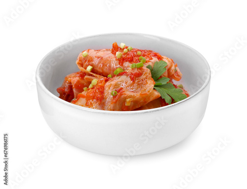 Bowl of delicious stuffed cabbage rolls cooked with homemade tomato sauce isolated on white