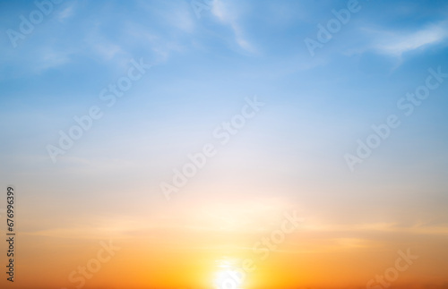 Real amazing Beautiful sunrise and luxury soft gradient orange gold clouds with sunlight on the blue sky perfect for the background  take in everning  Twilight sunset sky with gentle colorful clouds
