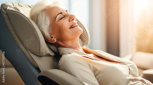 A happy senior woman is relaxing on her massage chair in the living room while napping.